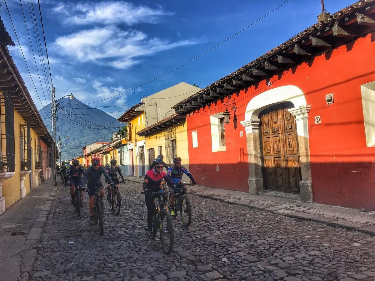 Bikers riding through the cobblestone streets of Guatemala City