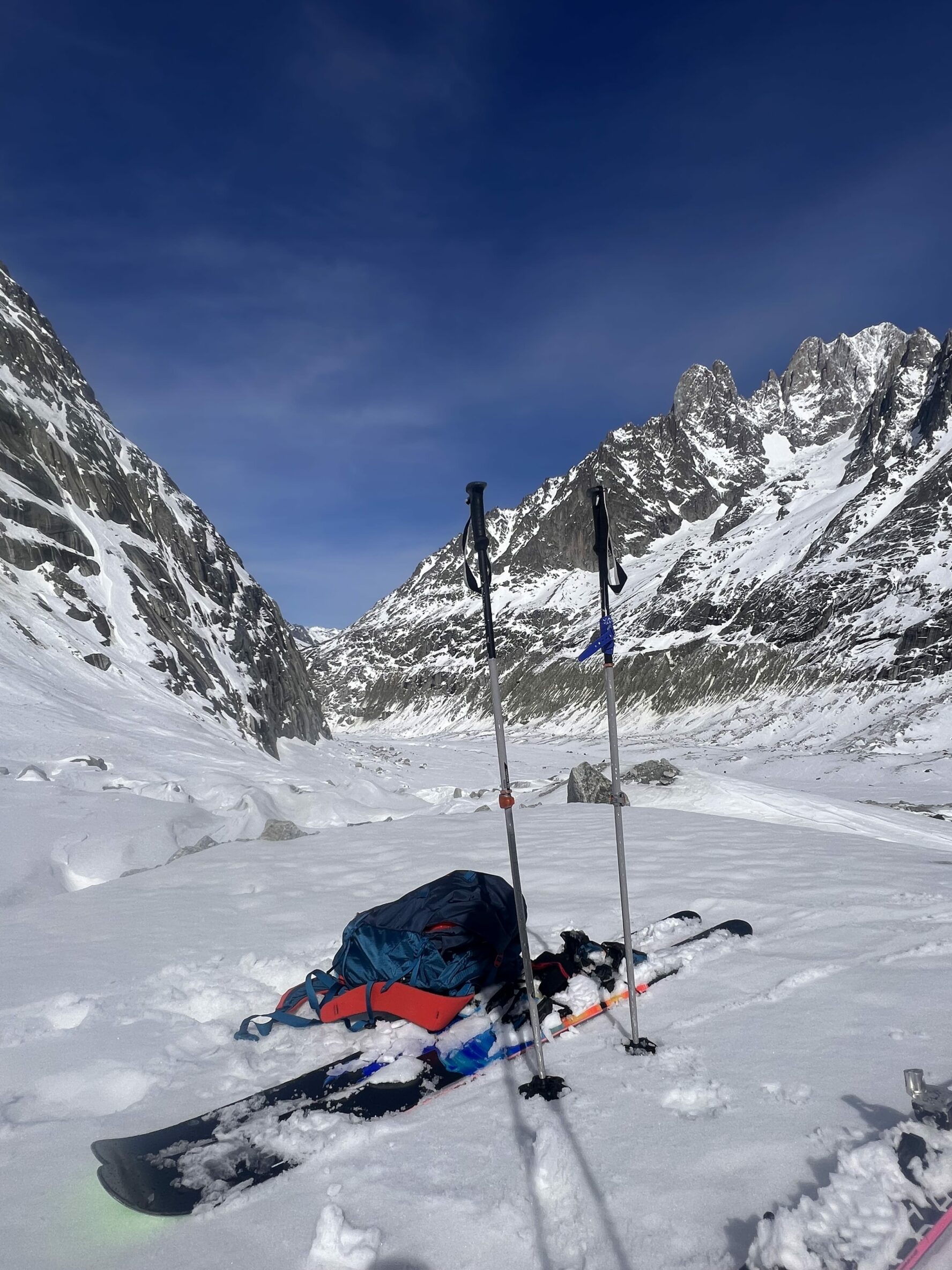 Skiing gear in the snow as the skiers take a break