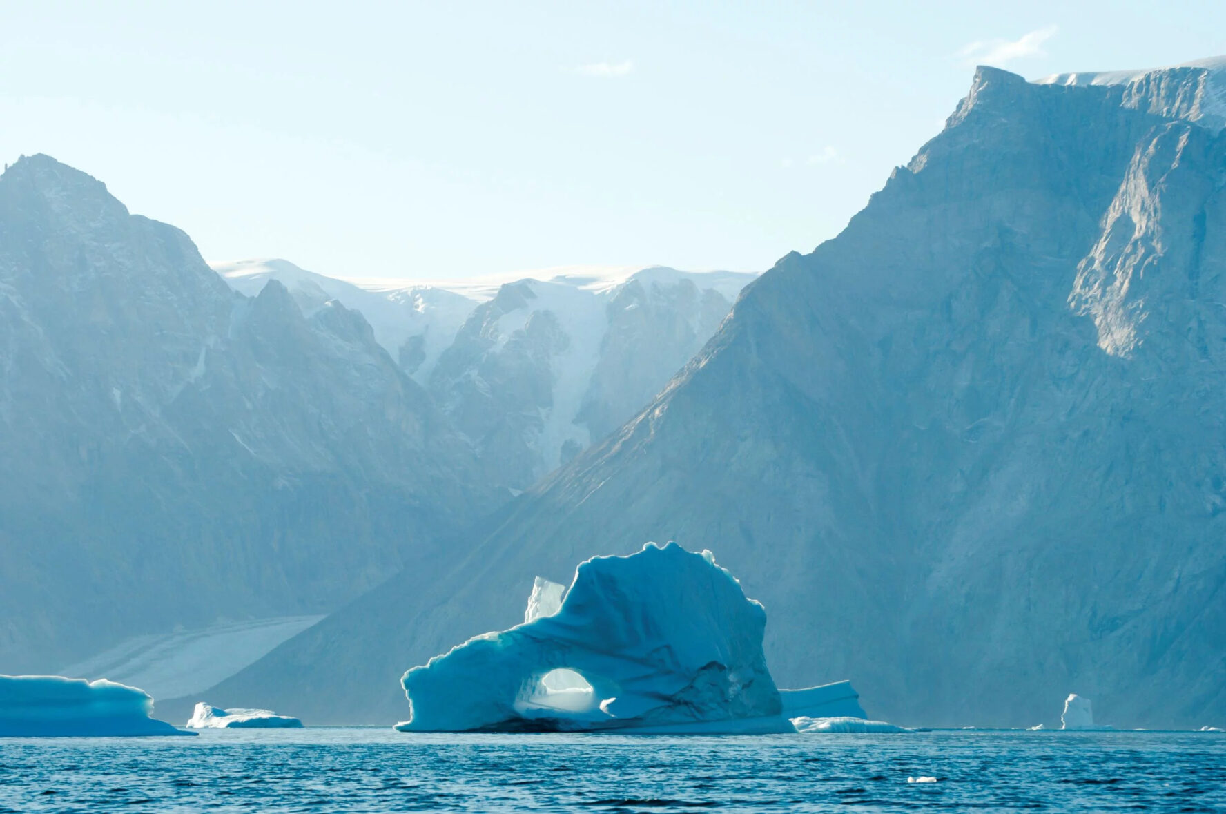 Cliffs and an iceberg in Greenland.