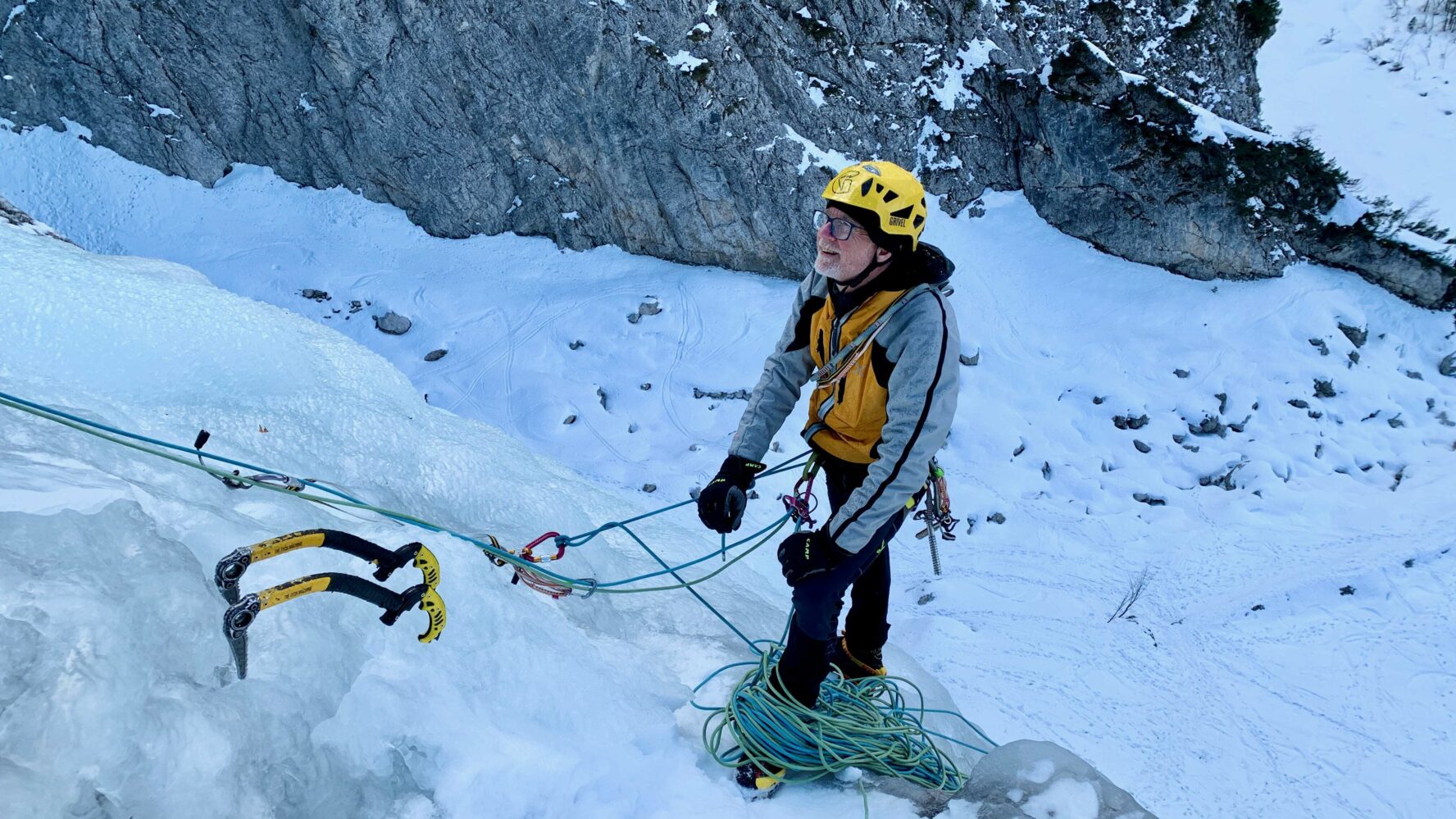 A climber standing on the waterfall.
