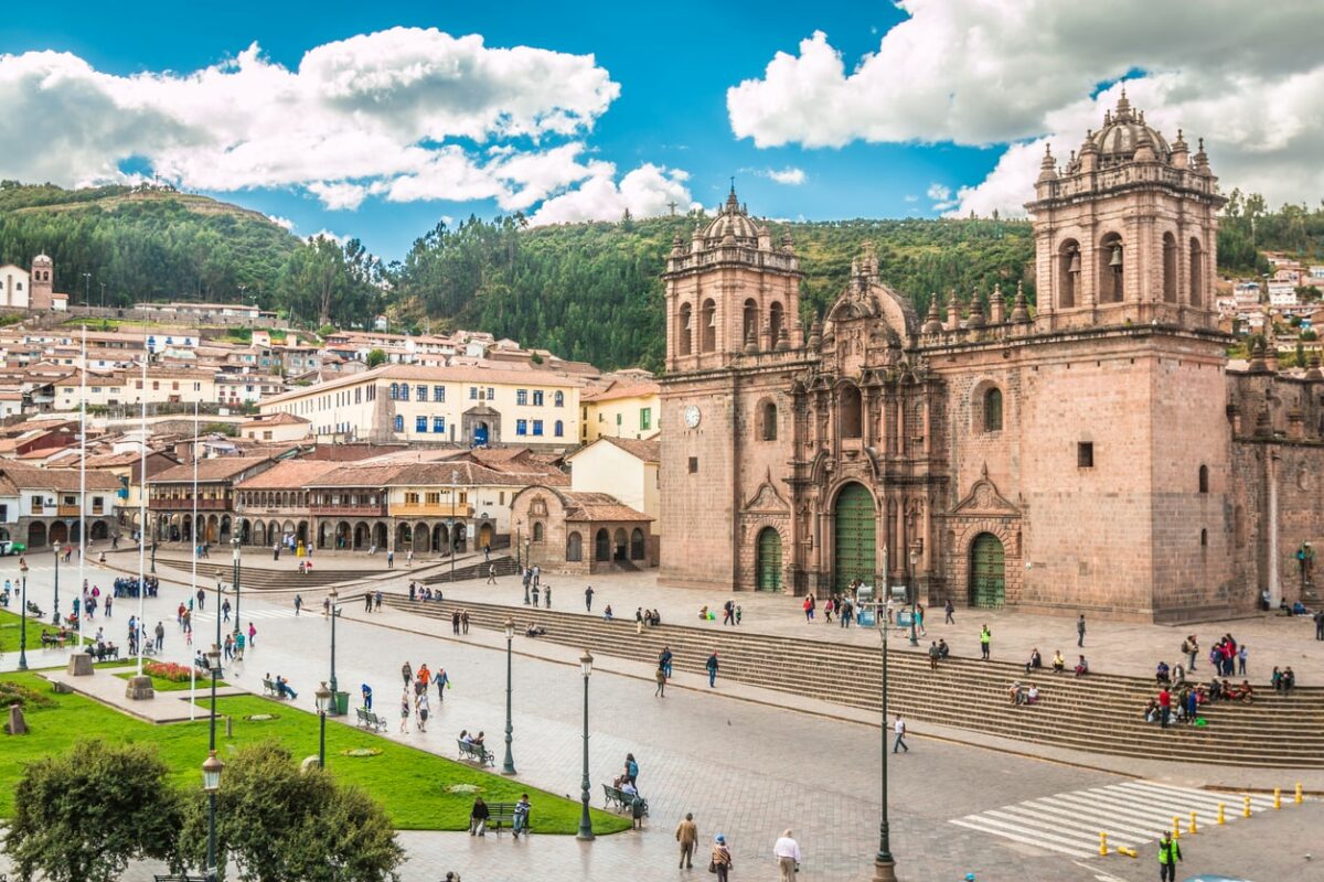 View of the central square in Cusco, Peru with a large baroque church from the Spanish colonial period.