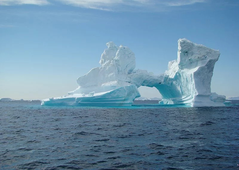 Iceberg rising from the Arctic sea.