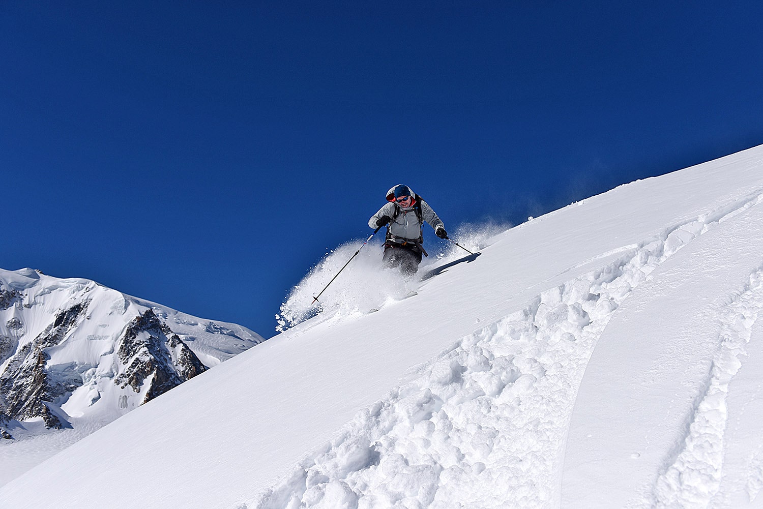 A skier shredding fresh Chamonix power