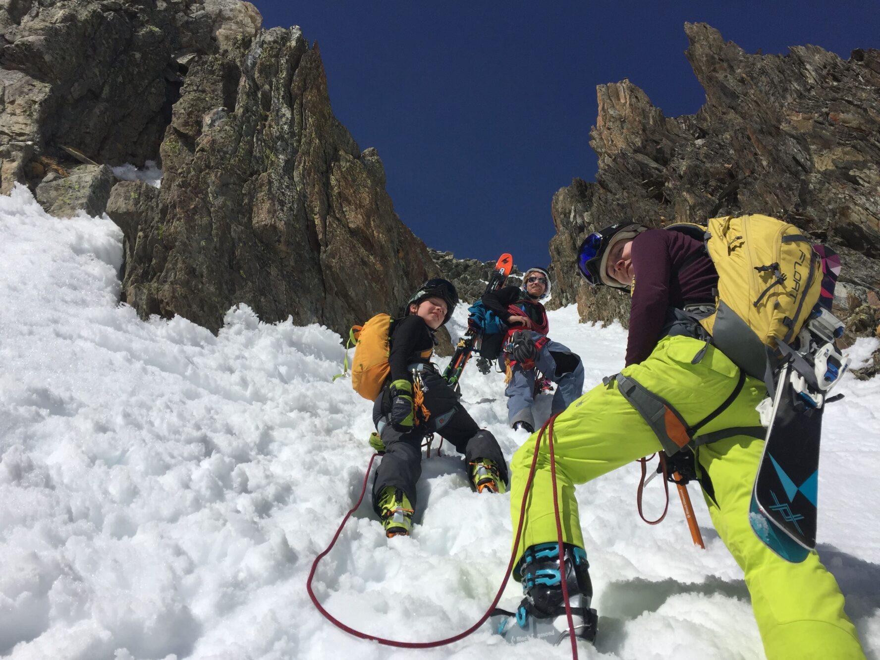 A group of skiers skinning to the top of the slope