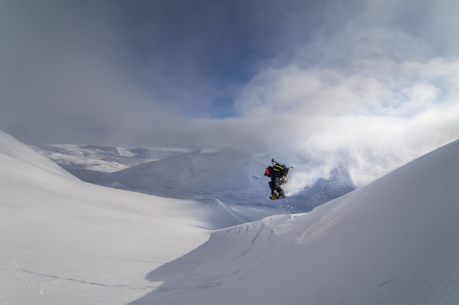 Snowboarder in clouds in Svalbard