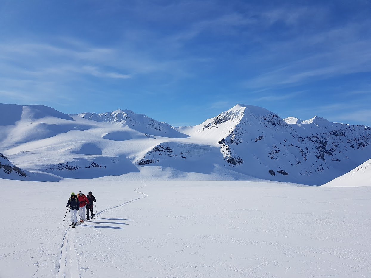Three skiers in Svalbard