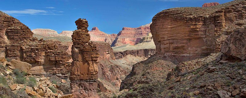 Typical landscapes of the Grand Canyon National Park with unique geological formation in shades of orange and red. 