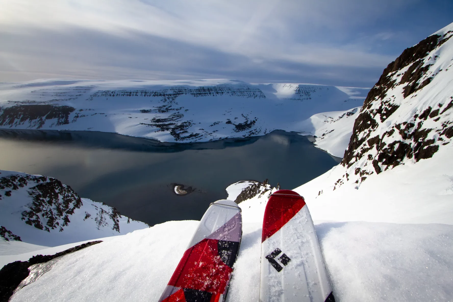 A skier enjoying a beautiful vista before his run in the Westfjords.