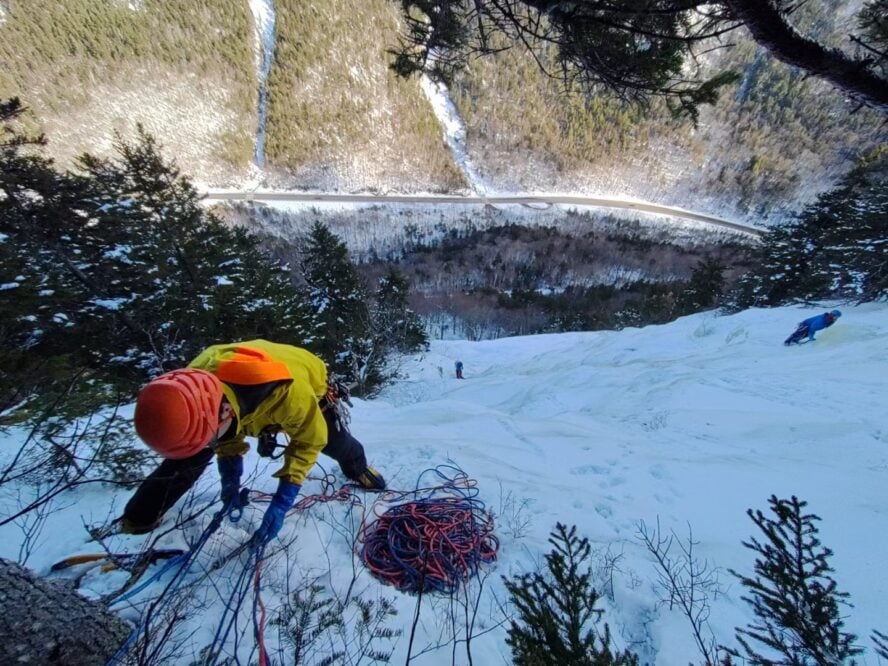 Anthony, and two other climbers, hanging on the side of an icy cliff in New Hampshire, practicing rope work.