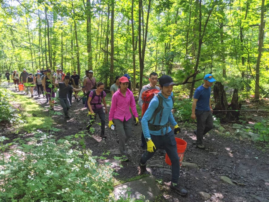 A group of volunteers with Trail Works helping to maintain trails at a local crag.