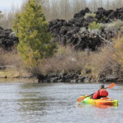 A paddler checking out the sites in the Columbia River Gorge.