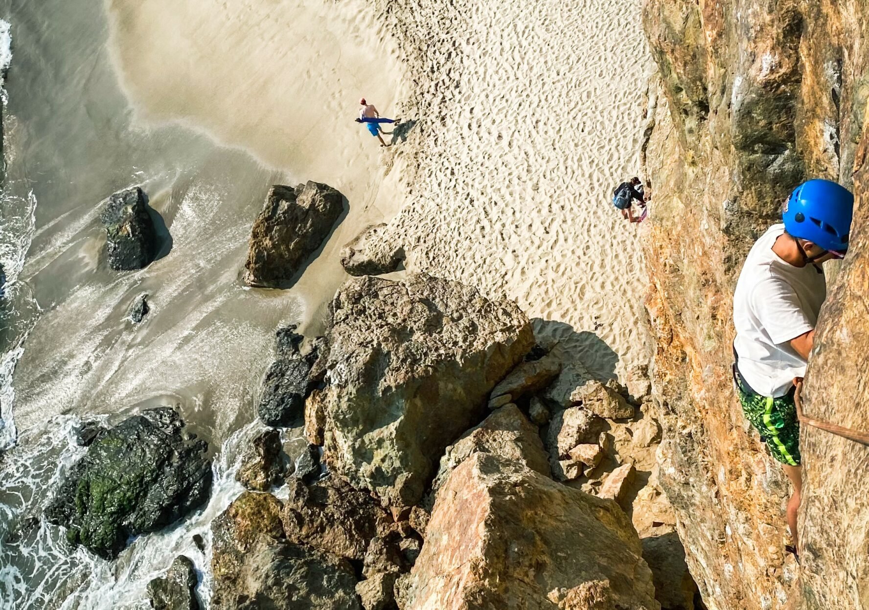 Climber going up on the rock of Point Dume.