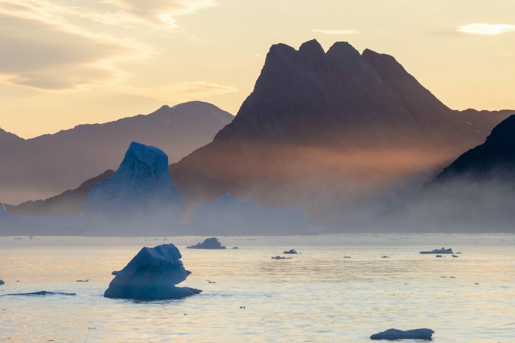 The morning myst rising above East Greenland.