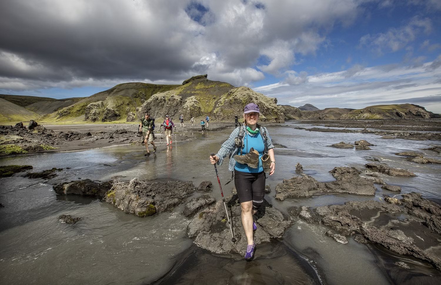 Fording a river on volcanic trails