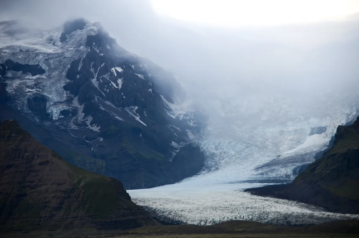 A glacier among some mountains in Iceland.