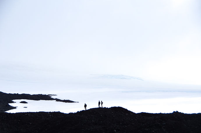 Hikers traversing a landscape in Iceland