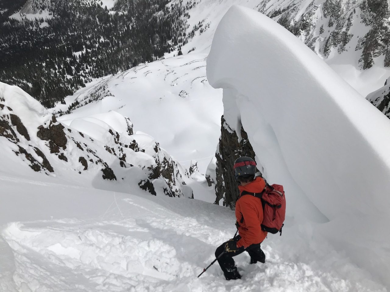 A group of novice ski mountaineers learning about ski mountaineering skills with their guide in Rocky Mountain National Park.