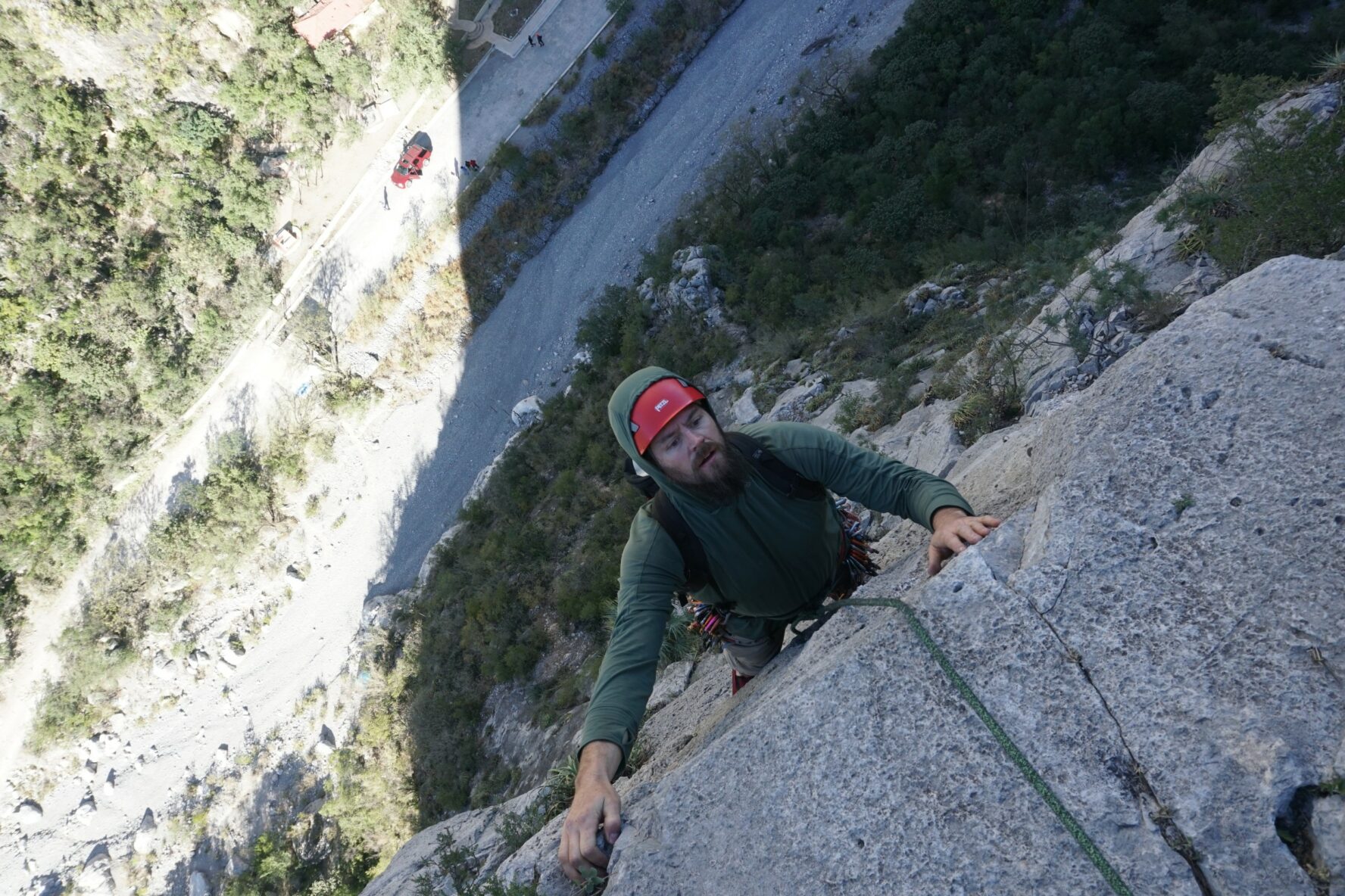 A rock climber approaching a ledge during his climb at El Potrero Chico.
