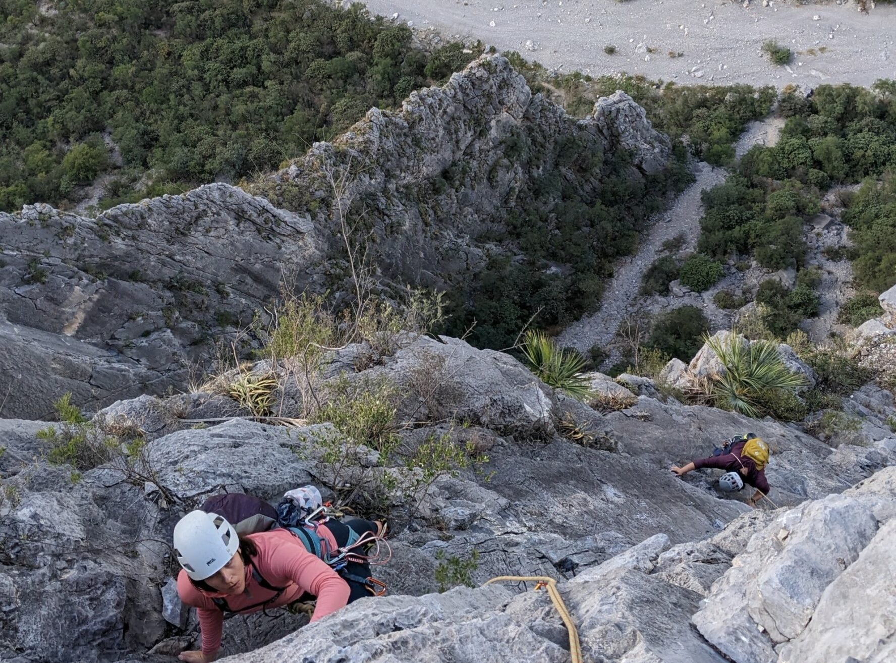 Two rock climbers climbing a route at a limestone crag at El Potrero Chico.