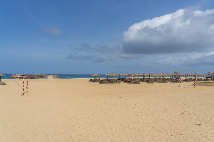 Parasols at Santa Maria beach in Sal Island - Cape Verde - Cabo Verde, background blue sky