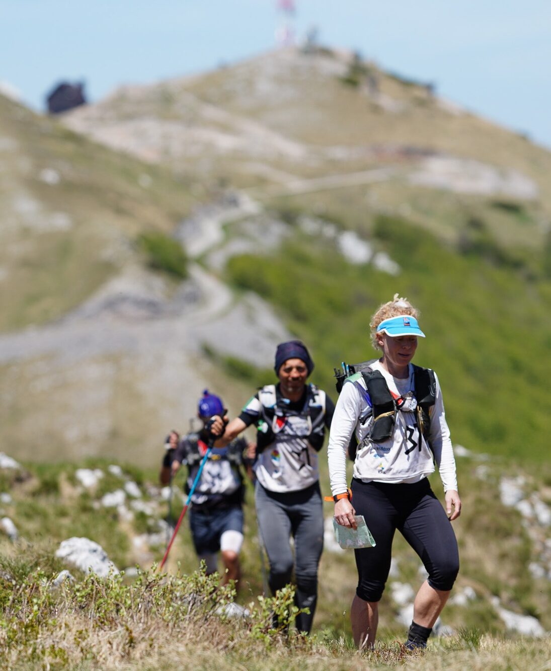 A group of adventurers trekking on Velebit during a sunny day