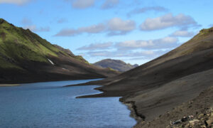 View of Langisjór and the mossy slopes which surround it from the shores of the lake.