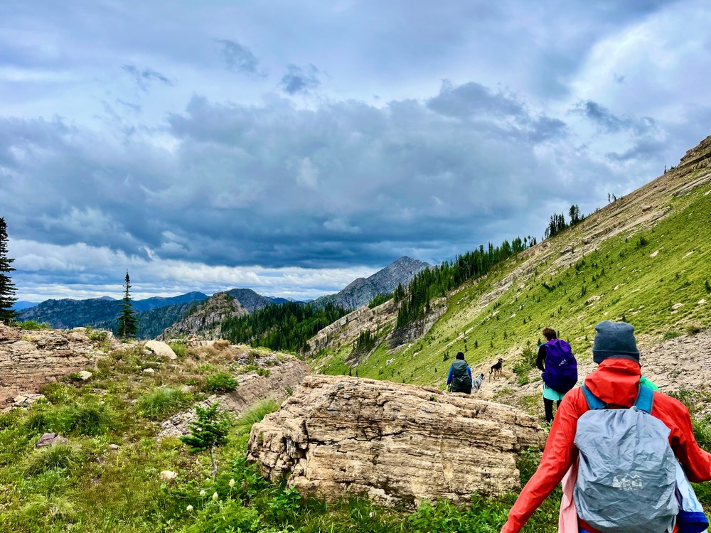 Hikers walking on a cloudy day in Whitefish, Montana