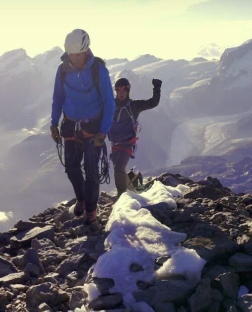 Two climbers finally arriving to Matterhorn peak after a strenuous climb Source: Guide (Webinar)