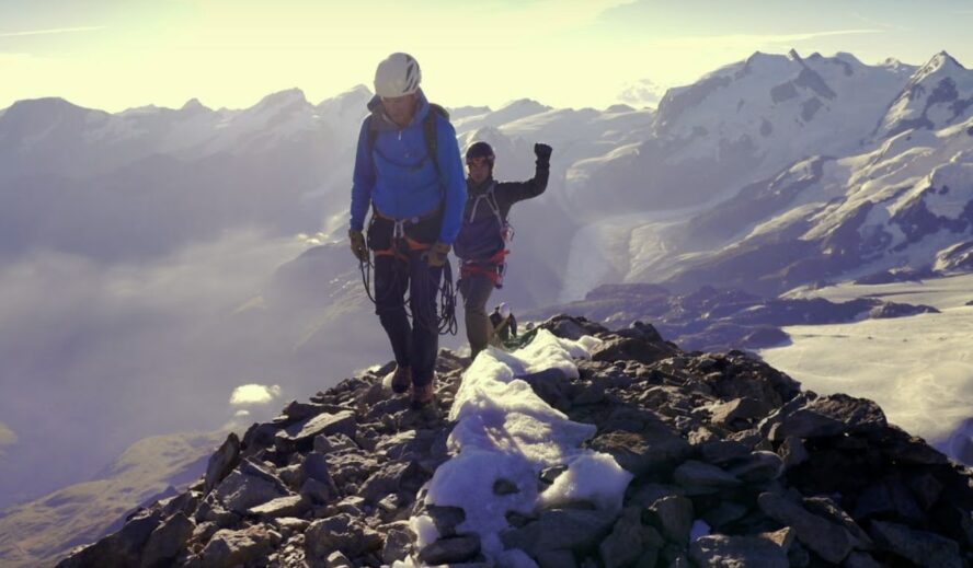 Two climbers finally arriving to Matterhorn peak after a strenuous climb Source: Guide (Webinar)