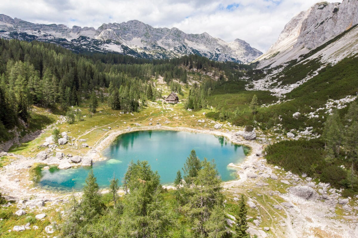 A lone hut by a lake in Triglav National Park, Slovenia.