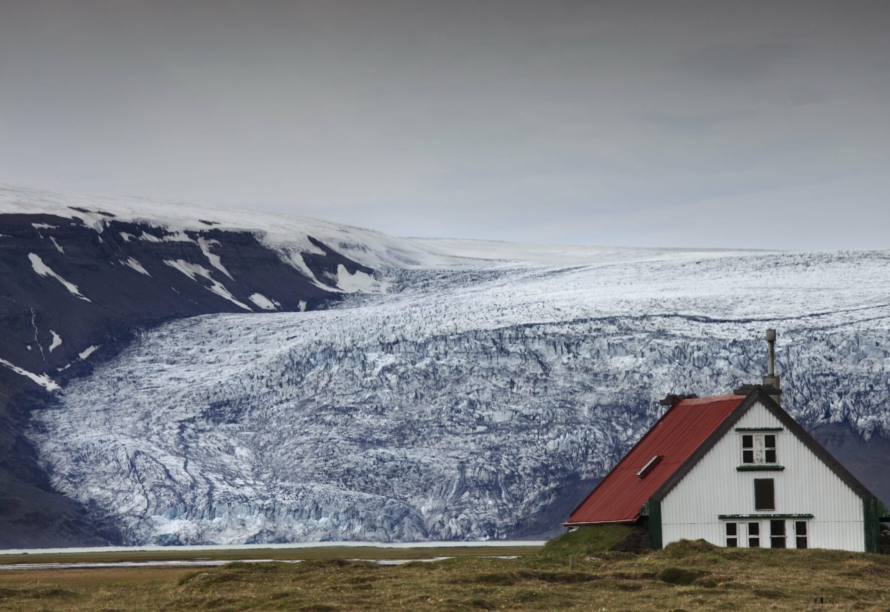 A mountain hut at the foot of a glacier in Icelandic Highlands