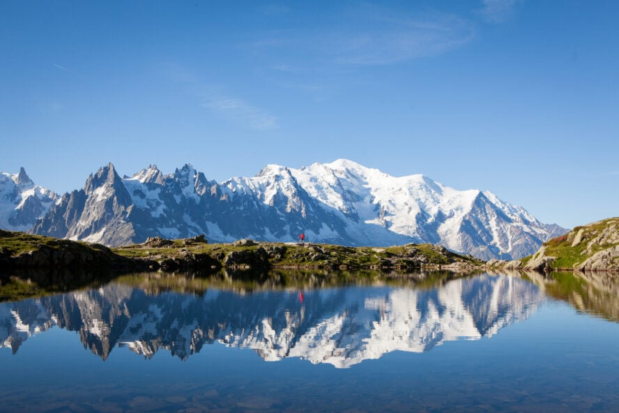 The glacial lake lac Blanc reflecting glaciated peaks seen during the Tour du Mont Blanc trek.