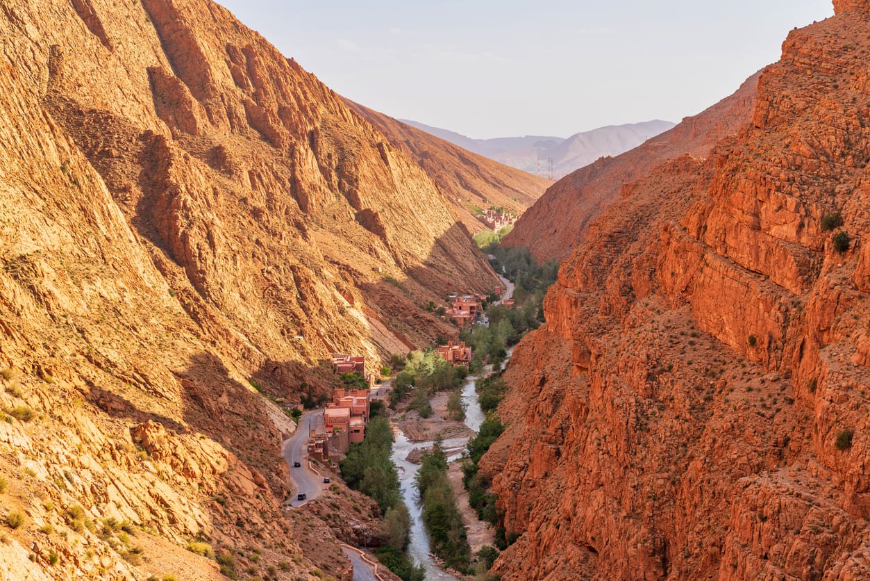 View of a river canyon in the Todgha Gorge area in south Morocco with traditional houses built beside the river bed.