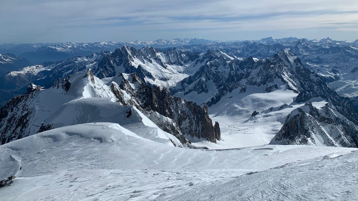 Rugged snow-covered Alpine peaks and valleys near Gran Paradiso in Italy.