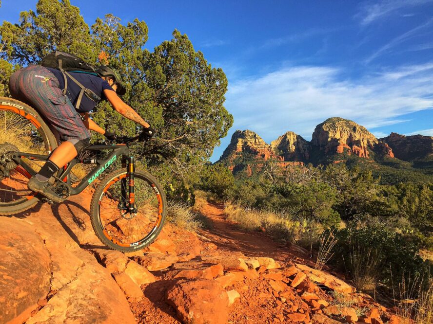 Mountain biker in Sedona riding a steep, rocky downhill trail