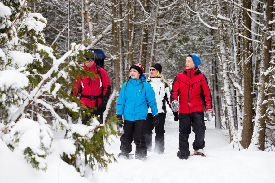 A family snowshoeing in the Gunks and admiring the scenery. Photo courtesy of iStock