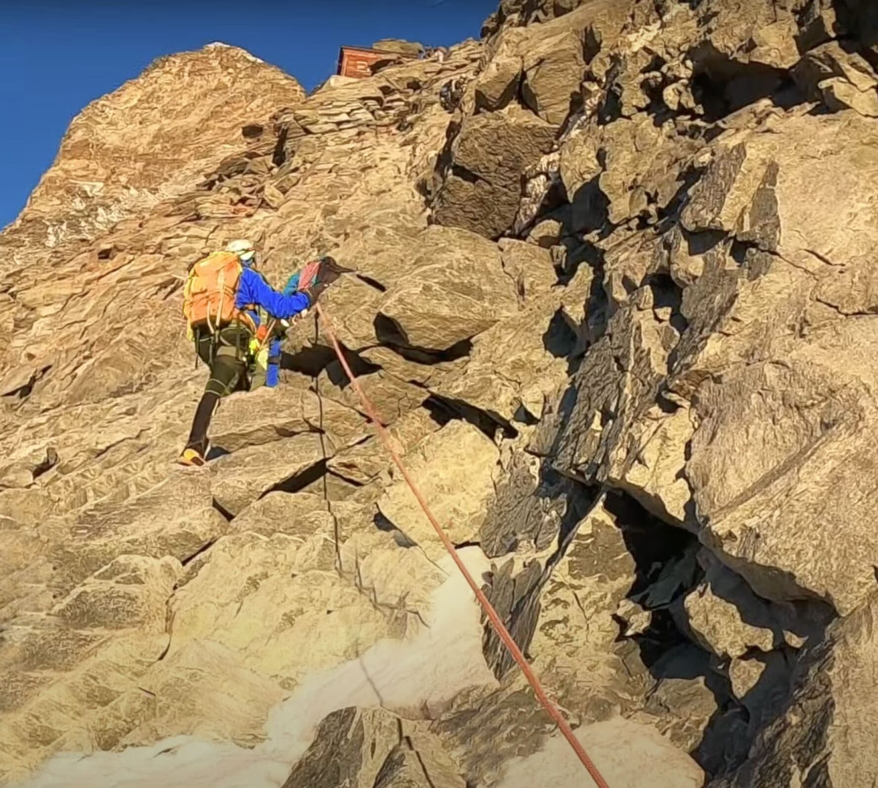A climber climbing the ropes en route to Matterhorn Source: Guide (Webinar)