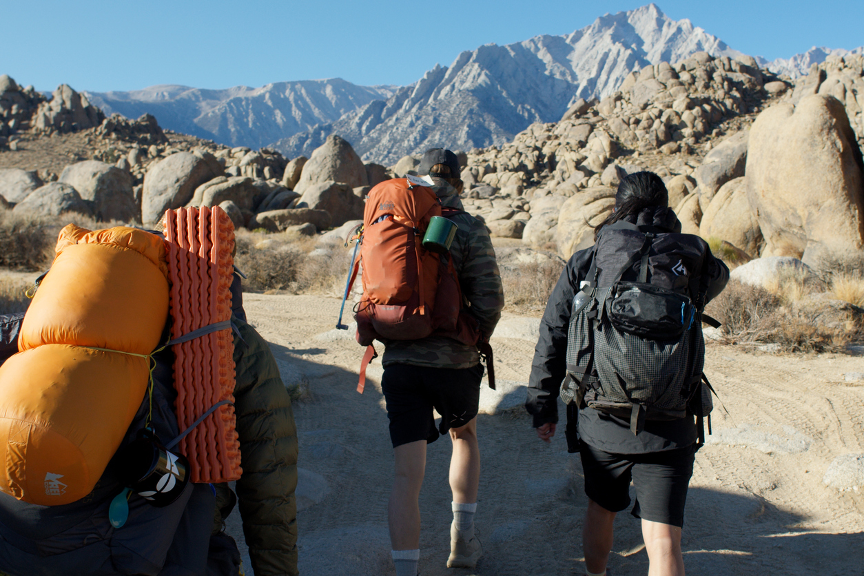 Three alpine climbers on a hike to start the Mountaineer’s Route to Mt Whitney.