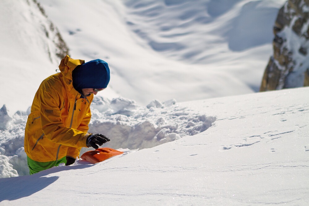 A backcountry skier learning some important skills during in-the-field avalanche education at Mt Baker.