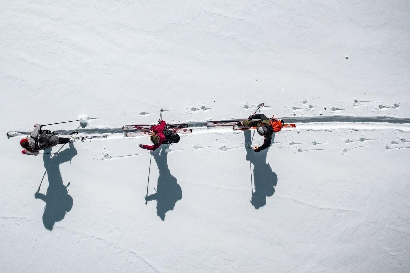 A group of backcountry skiers moving on a flat surface on their skis in the Summit County.