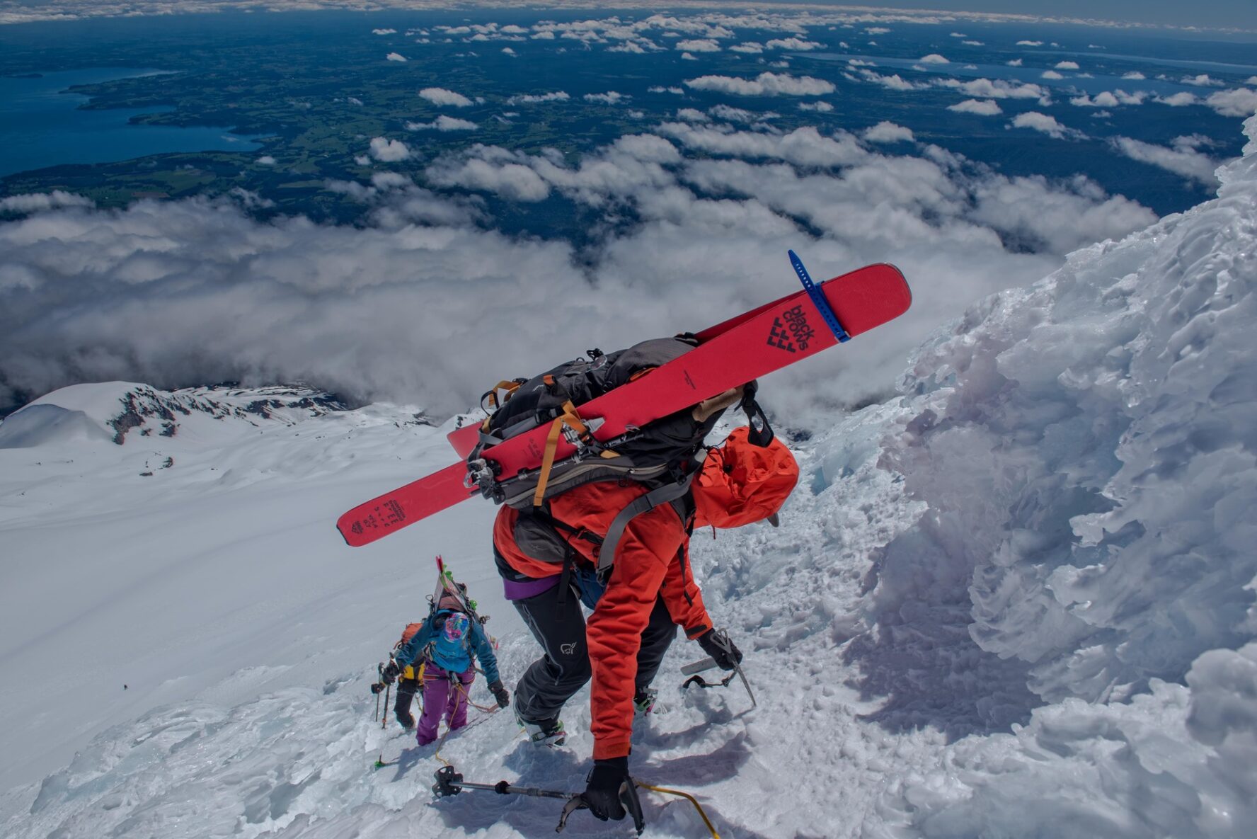 Skiers scrambling on a challenging slope in Chile.