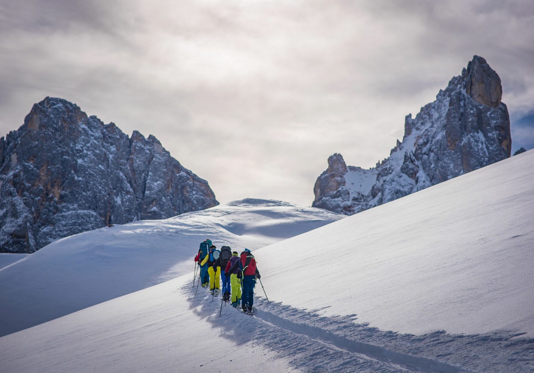 A group of backcountry skiers in search of the best slopes in the Brenta Dolomites.