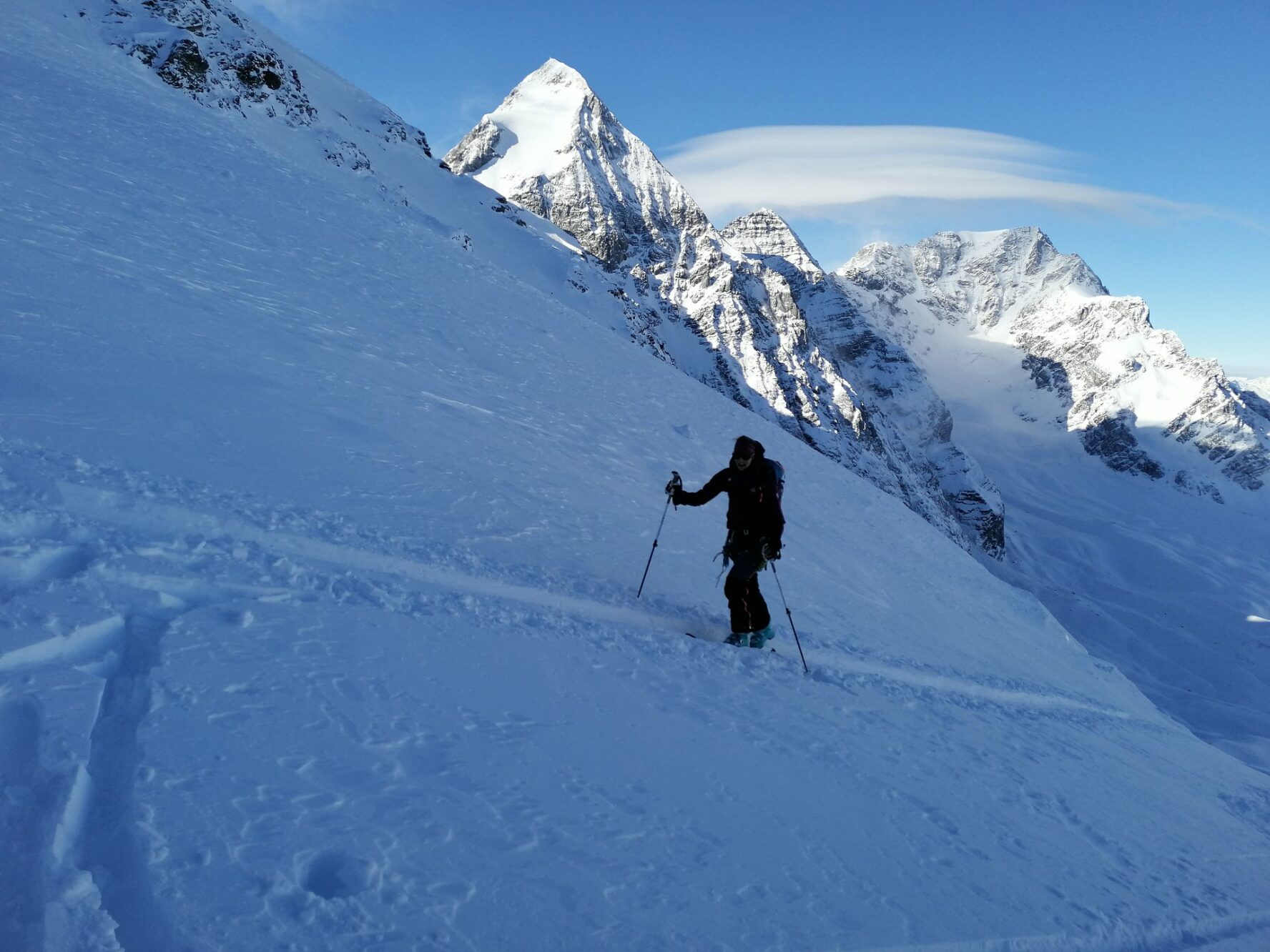 A backcountry skier skinning in search of the best slopes in the Ortler area,