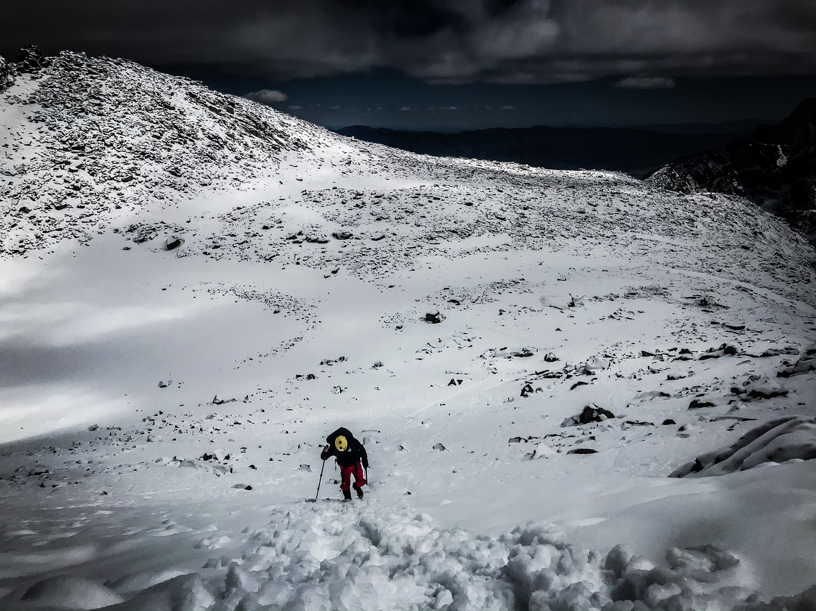 A mountaineer on their way to the summit of Mt Whitney during winter.