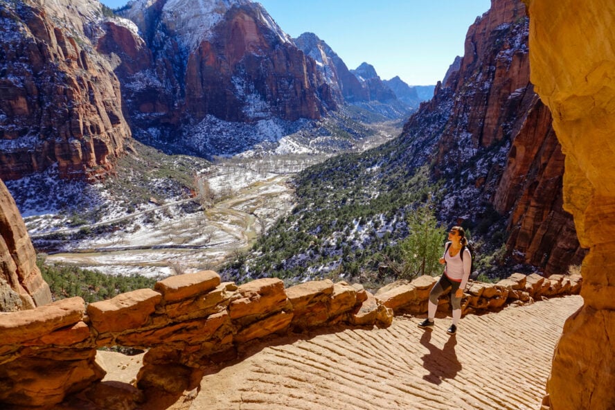 Female hiker going up Zion’s Angels Landing Trail in winter