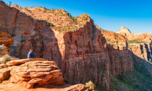 Man sitting on a rock on Canyon Overlook