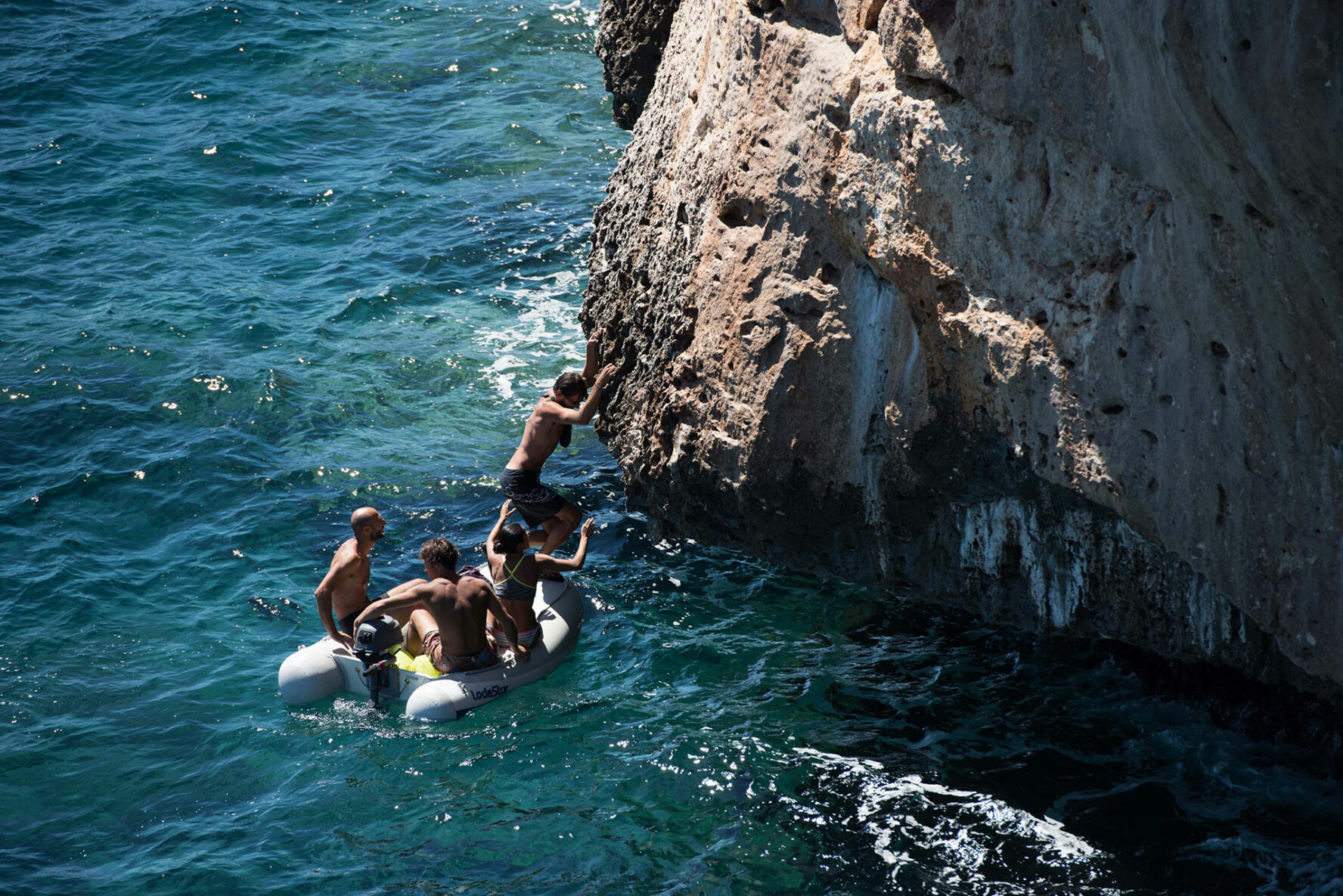 Climbers on a dinghy