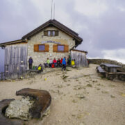 Hikers resting at Rifugio Nuvolau on the Alta Via 1 trek