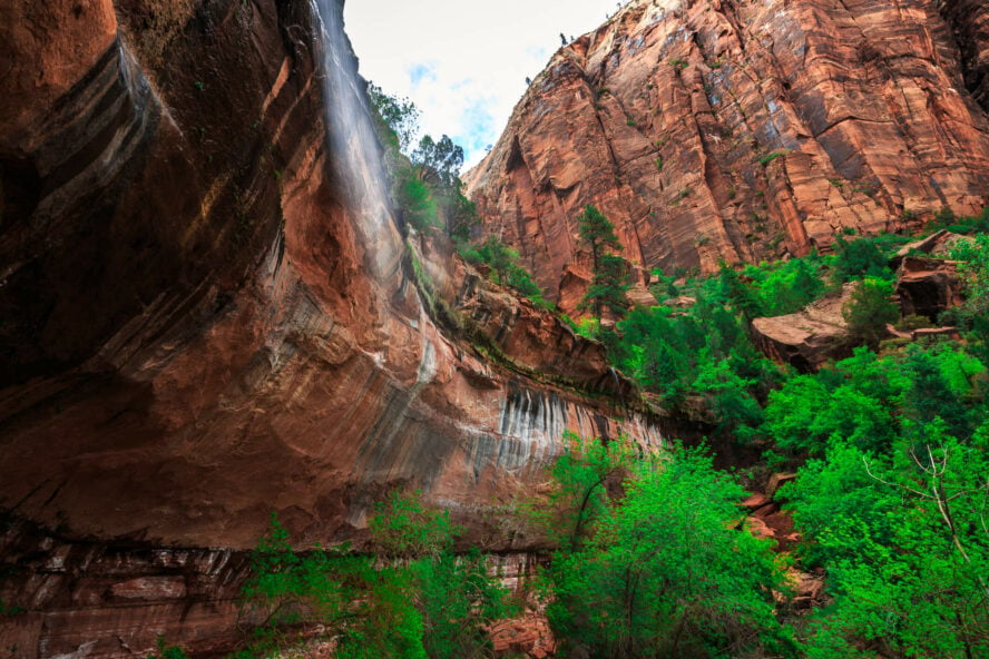 Waterfall trickling down a ledge above the Emerald Pools Trail