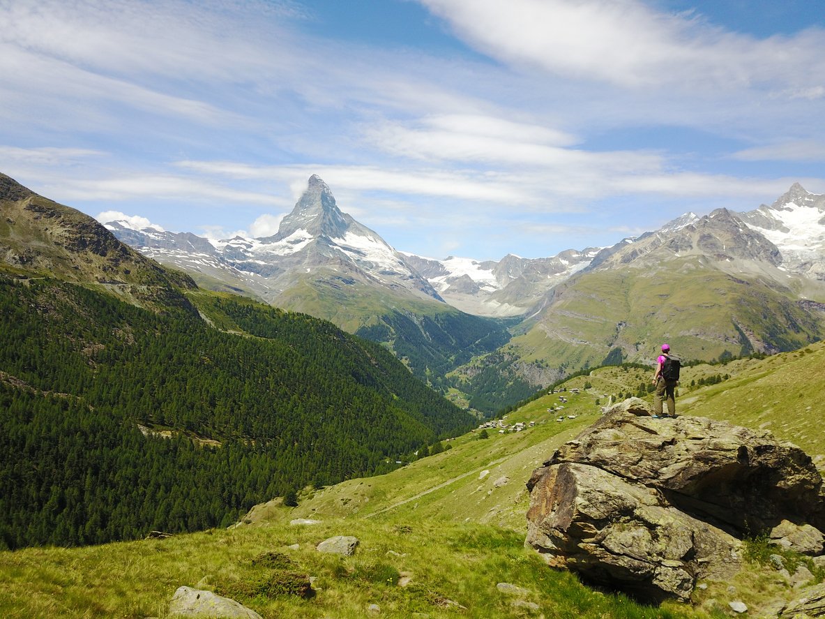 Hiking in the Swiss Alps with views of Matterhorn.